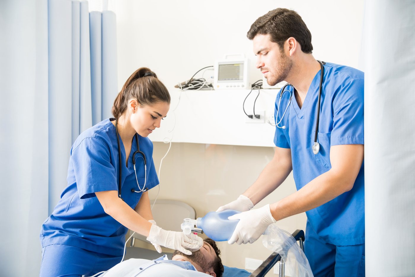 Healthcare professionals performing bag-valve-mask ventilation during Advanced Life Support training